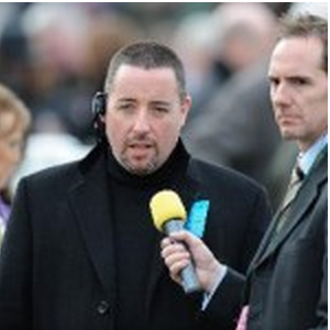 Rory Delargy of the Racing Consultants horse racing tipping service being interviewed wearing a headset wiith a big yellow microphone 